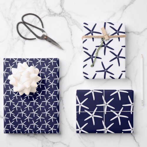 White starfish on a navy blue background wrapping paper sheets