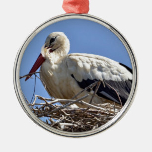White stork in its nest metal ornament