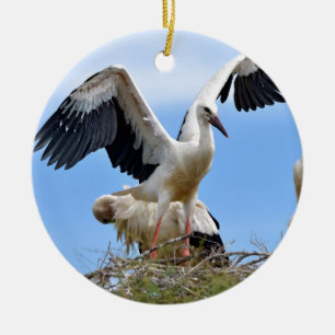 White storks on their nest ceramic ornament