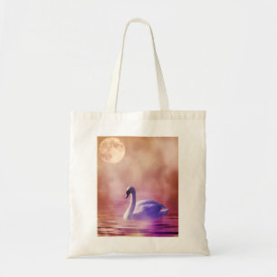 White Swan floating on a misty lake Tote Bag