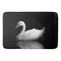 White swan on black bath mat