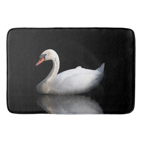 White swan on black bath mat