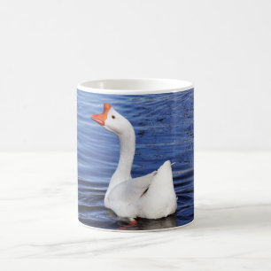 white swimming goose in blue water coffee mug