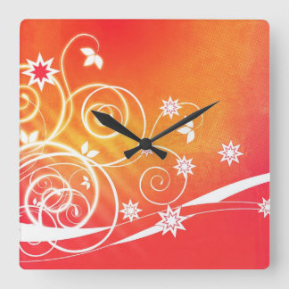 White swirls and florals on orange square clock