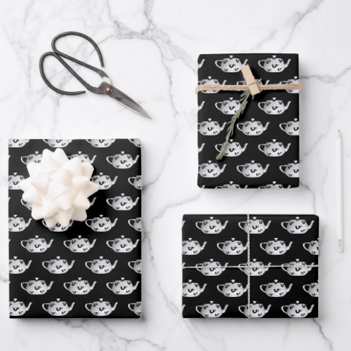 White Teapots On Black Wrapping Paper Sheets