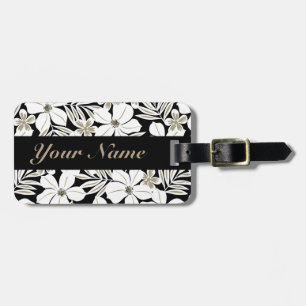 White tropical flowers on black luggage tag