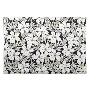 White tropical flowers on black placemat
