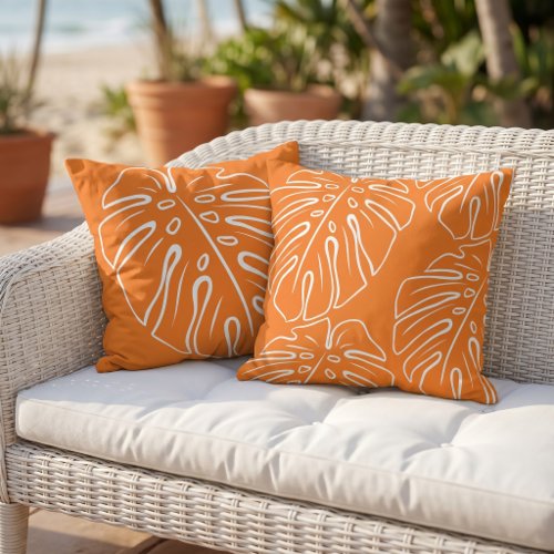 White Tropical Leaf Motif On Bright Orange Outdoor Pillow