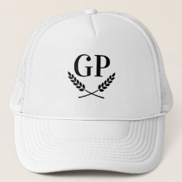 White trucker hat with laurel crest monogram logo