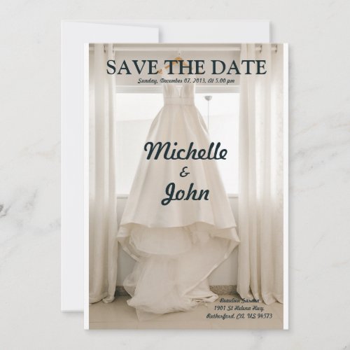 white wedding dress on hanger near window invitation