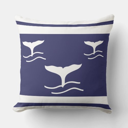 white whale tails on navy blue pillow