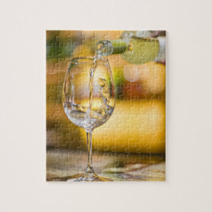 White wine is poured from bottle in restaurant. jigsaw puzzle