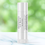 White with black text lip balm tube label