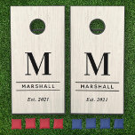 White Wood Grain Personalized Wedding Monogram Cornhole Set<br><div class="desc">Elegant and minimalistic custom monogrammed cornhole yard game set features classic black monogram text that can be personalized with a last name initial, last name, and year established (married). A beautiful keepsake for and after the wedding day. A white washed faux wood grain background adds a rustic textured look to...</div>