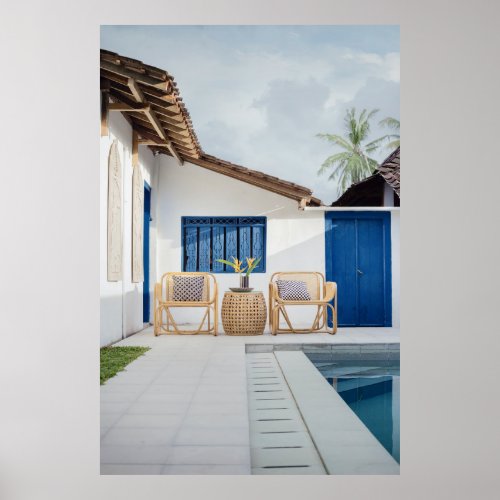 Wicker table and two chairs near swimming pool poster