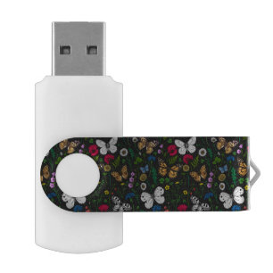 Wild flowers and butterflies on black flash drive