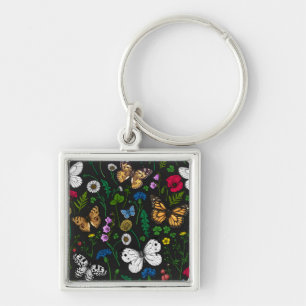 Wild flowers and butterflies on black keychain