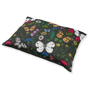 Wild flowers and butterflies on black pet bed