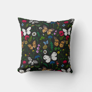 Wild flowers and butterflies on black throw pillow