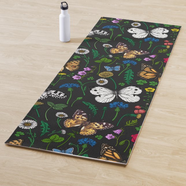 Wild flowers and butterflies on black yoga mat (In Situ)