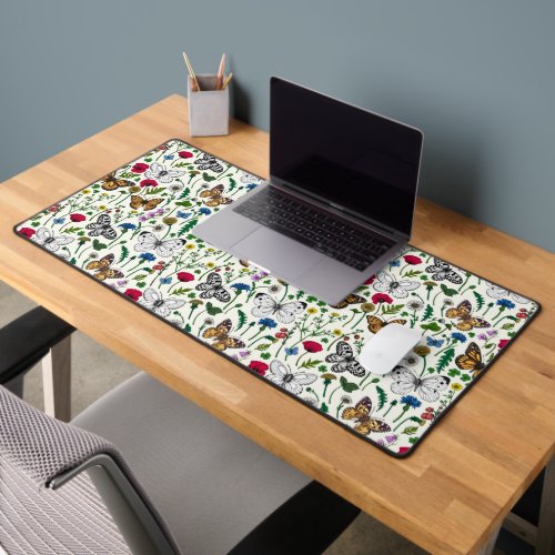 Wild flowers and butterflies on white desk mat