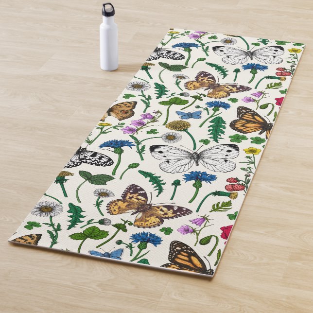 Wild flowers and butterflies on white yoga mat (In Situ)