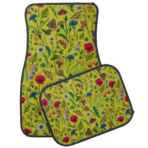 Wild flowers and moths on green car floor mat