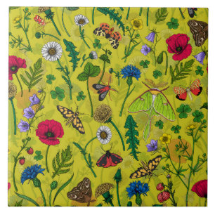 Wild flowers and moths on green ceramic tile