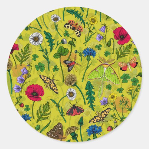 Wild flowers and moths on green classic round sticker