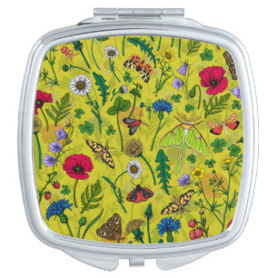Wild flowers and moths on green compact mirror