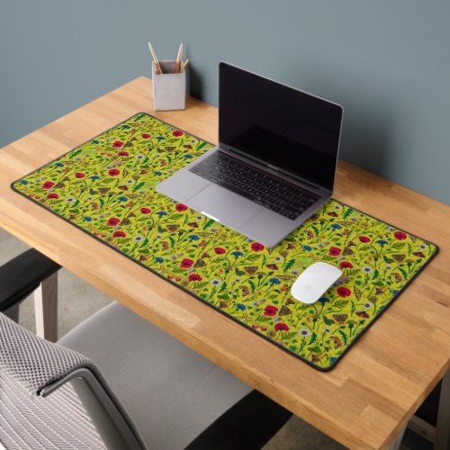 Wild flowers and moths on green desk mat