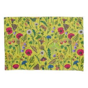 Wild flowers and moths on green pillow case