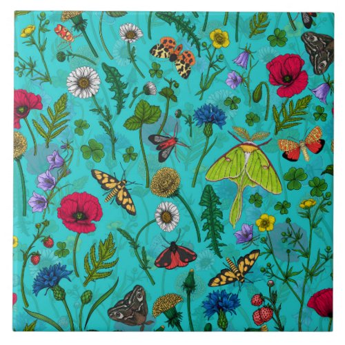 Wild flowers and moths on teal ceramic tile