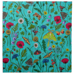 Wild flowers and moths on teal cloth napkin