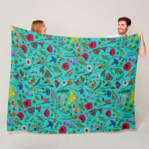 Wild flowers and moths on teal fleece blanket