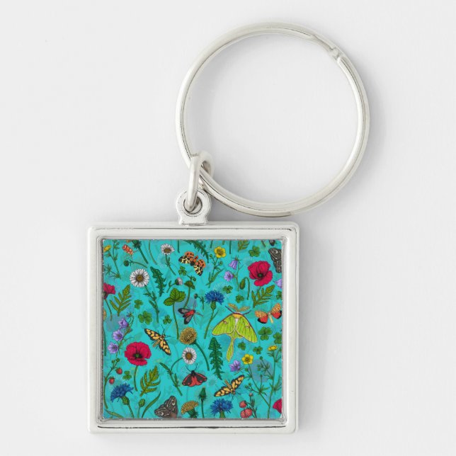Wild flowers and moths on teal keychain (Front)