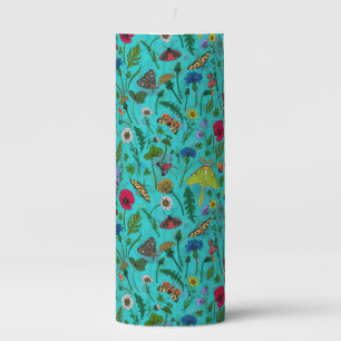 Wild flowers and moths on teal pillar candle