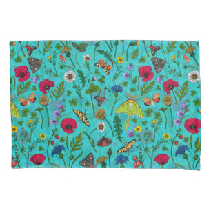 Wild flowers and moths on teal pillow case
