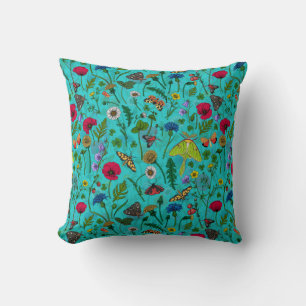 Wild flowers and moths on teal throw pillow