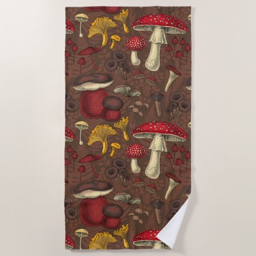 Wild mushrooms on brown beach towel