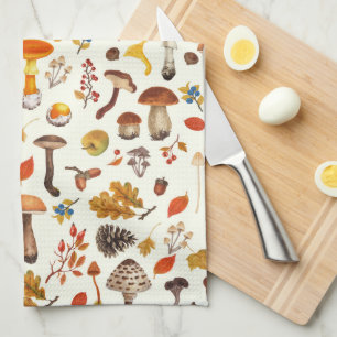 Wild mushrooms on off white kitchen towel