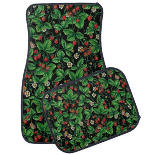 Wild strawberries on black car floor mat
