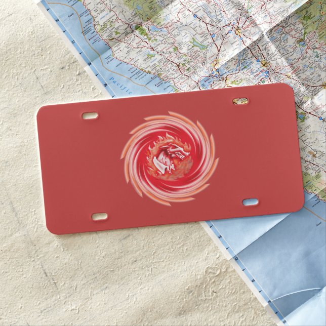 Wild Wolf Whirling red plastic car license plate (In Situ)