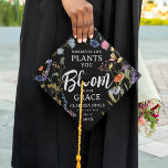 Wildflower 'Bloom with Grace' Graduate Graduation Cap Topper<br><div class="desc">After graduating continue to Bloom with this gorgeous Wildflower Motivational Quote Graduation Cap. Design features a black background decorated with watercolor wildflowers and botanical foliage, the text 'Wherever Life Plants You, Bloom with Grace in a combination of elegant serif fonts and white calligraphy script. Simply customize name, place of study...</div>