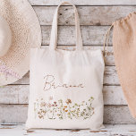 Wildflower Boho Bridesmaid Name Tote Bag<br><div class="desc">Elevate your bridesmaid proposal or thank-you gesture with our charming Wildflower Boho Bridesmaid Name Tote Bag! Crafted with love and adorned with intricate floral designs, this tote bag perfectly captures the essence of bohemian elegance. Each bag is personalized with your bridesmaid's name, adding a thoughtful touch that celebrates her unique...</div>