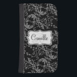 Wildflower damask black white cell flap wallet<br><div class="desc">Stylish modern wildflower damask patterned graphic cell phone flap wallet case. Customize the with your name and one monogram initial,  currently reads Camille R. Original pattern and design by Sarah Trett.</div>