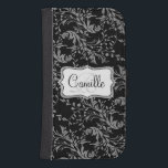 Wildflower damask black white cell flap wallet<br><div class="desc">Stylish modern wildflower damask patterned graphic cell phone flap wallet case. Customize the with your name and one monogram initial,  currently reads Camille R. Original pattern and design by Sarah Trett.</div>