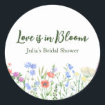 Wildflower Love is in Bloom Bridal Shower Party  Classic Round Sticker<br><div class="desc">Our Wildflower Love is in Bloom bridal shower party stickers, are designed to infuse your celebration with the perfect touch of romance. Crafted with delicate wildflowers in full bloom, these stickers evoke the timeless beauty of nature's bounty, symbolizing the blossoming love between the happy couple. Each sticker features a charming...</div>