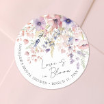 Wildflower Love Is In Bloom Floral Bridal Shower Classic Round Sticker<br><div class="desc">Love Is In Bloom Bridal Shower Round Sticker. Add a sweet and whimsical touch to your bridal shower favors, packaging, or decorations with this round sticker design, perfect for a garden-themed celebration. The layout features delicate watercolor wildflowers and greenery in a soft palette of blush pinks, dusty rose, lilac, lavender,...</div>