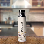 Wildflowers beige custom name script water bottle<br><div class="desc">A beige colored background. Decorated with wildflowers in yellow and purple.  Personalize and add your name.   Gray handwritten style script.</div>